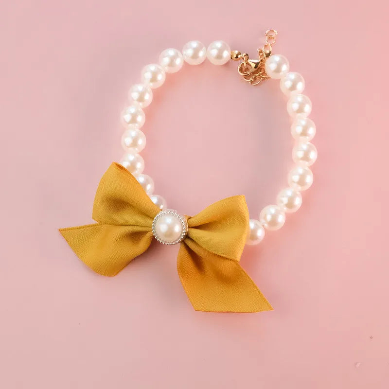 Collier de perles pour chat avec noeud jaune