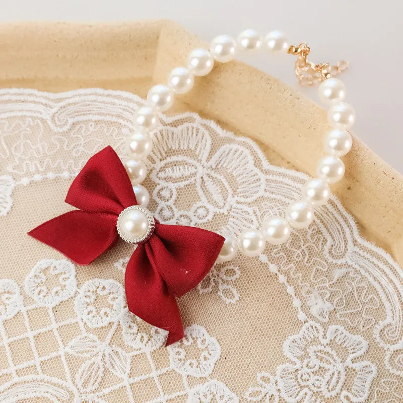 Collier de perles pour chat à noeud plusieurs coloris